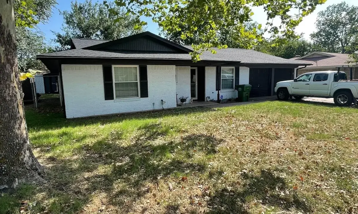 Professional roofing crew working on a residential roof in Ham Lake